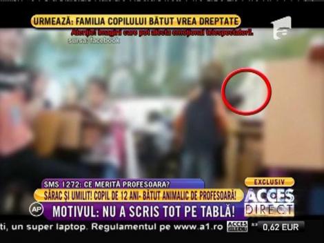 O profesoară îşi bate crunt un elev, sub ochii uluiţi ai colegilor lui