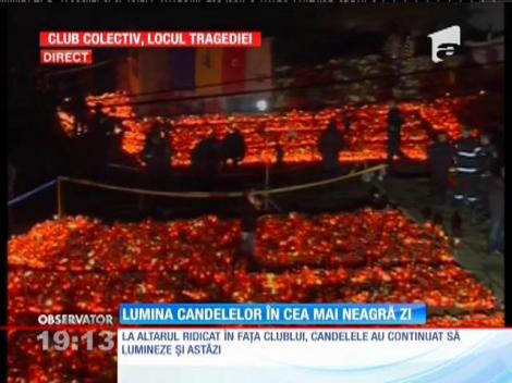 Altar de lumină în fața clubului Colectiv
