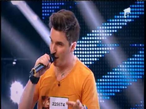 Robbie Williams - Let Me Entertain You. Vezi interpretarea lui Alex Vasilache, la X Factor!