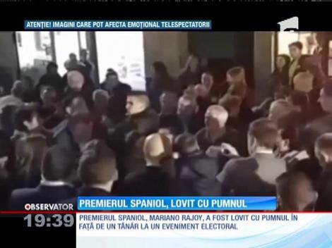 Premierul spaniol, lovit cu pumnul