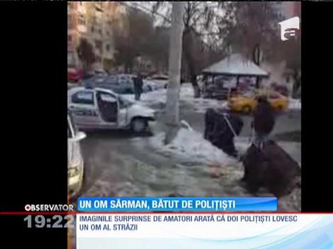 Om al străzii, bătut de poliţişti
