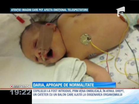 Daria, fetiţa născută cu o gravă malformaţie a inimii, e aproape de normalitate