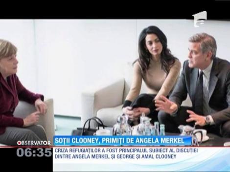George Clooney şi cancelarul german Angela Merkel au discutat despre criza migranţilor din Europa
