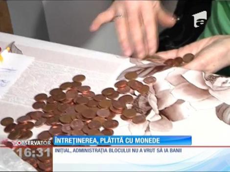 Un tânăr din Galaţi a plătit întreţinerea cu monede de 5 şi 10 bani. Numărătoarea banilor nu s-a terminat nici acum