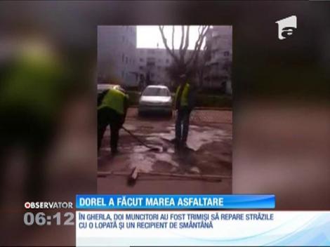 În Gherla, doi muncitori au fost trimiși să repare străzile cu o lopată și un recipient de smântână