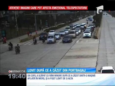 Copil lovit de altă mașină după ce a căzut din portbagaj