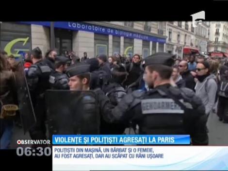 Proteste violente în Franţa. O maşină de poliţie a fost incendiată cu doi agenţi la bord