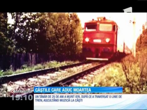 Un tânăr de 25 de ani a murit după ce a traversat o linie de tren, ascultând muzică la căști