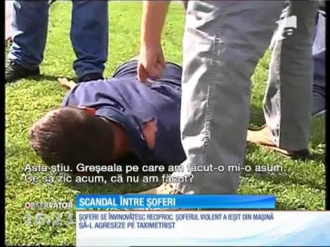 Șofer pus la pământ de polițiști după ce a înjurat un taximetrist