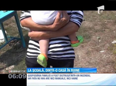 O fată de 13 ani se pregăteşte să meargă mâine la şcoală dintr-o casă făcută scrum