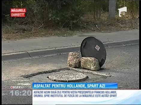 Drumul spre Institutul de Fizică de la Măgurele asfaltat pentru vizita preşedintelui francez Francois Hollande, este spart de muncitori