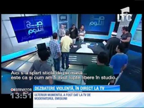A scos pantoful și i-a dat-o! Doi ”respectabili` s-au luat la bătaie într-un studio de televiziune