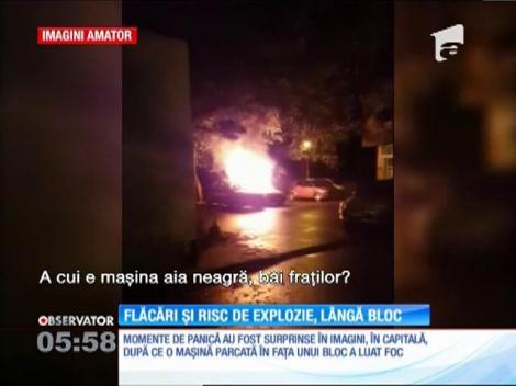 Momente de panică pe o stradă din Bucureşti! O maşină parcată în faţa unui bloc a luat foc