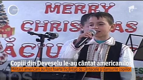 Copiii din Deveselu le-au arătat americanilor cum petrec românii sărbătorile de iarnă