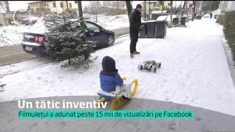 Un tătic inventiv a ataşat sania la o maşinuţă cu telecomandă!