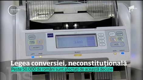 Lovitură grea pentru românii care au credite în franci elveţieni. Legea conversiei, neconstituţională!