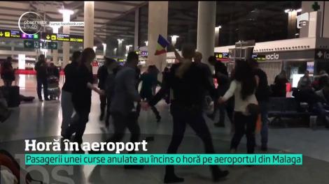 Blocaţi pe aeroport în Spania, după ce cursa care trebuia să îi aducă acasă a fost anulată, mai mulţi români au încins o horă