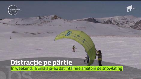 Pasionații de snowkiting, distracție pe pârtie