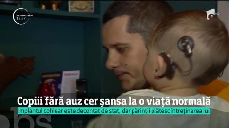 Copiii fără auz cer şansa la o viaţă normală