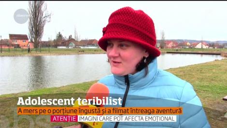 Imagini NERECOMANDATE celor slabi de îngeri! Un băiat minor s-a urcat pe o macara, la 30 de metri înălțime. Filmulețul face furori pe internet!