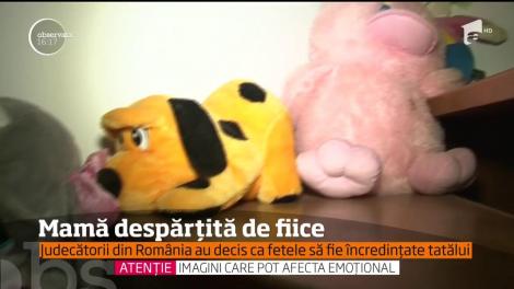 O mamă româncă, despărţită de fiicele ei