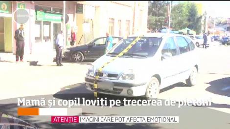 Un copil de doi ani şi mama lui, care îl ţinea în braţe, au fost izbiţi în plin de o maşină, chiar pe o trecere de pietoni din Dej!