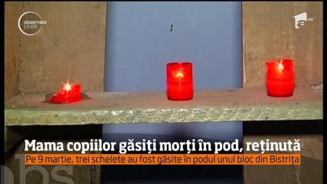 Mama copiilor găsiți morți în pod a fost reținută de polițiști