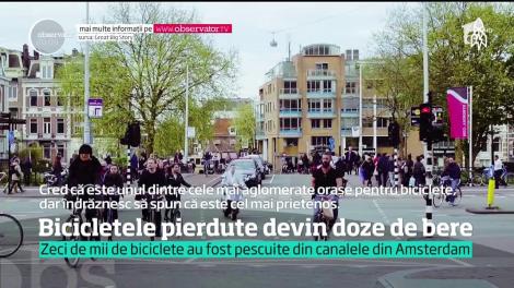 Zeci de mii de biciclete pierdute au fost pescuite din canalele din Amsterdam şi transformate apoi în doze de bere sau suc