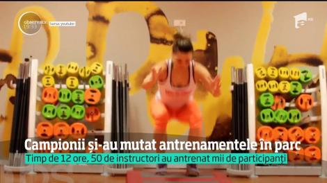 Aerobicul în aer liber este noua modă. 50 de instructori au mutat sala într-un parc din Bucureşti