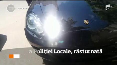 Accident spectaculos în Capitală. O maşină a Poliţiei Locale Sector 3 s-a răsturnat cu roţile în sus după cea fost lovită de un autoturism de lux