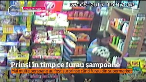 Prinși în timp ce furau şampoane din supermarket