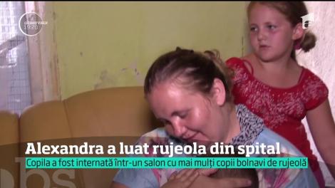 Alexandra, o copilă de cinci luni, prea mică ca să fie protejată de un vaccin împotriva rujeolei