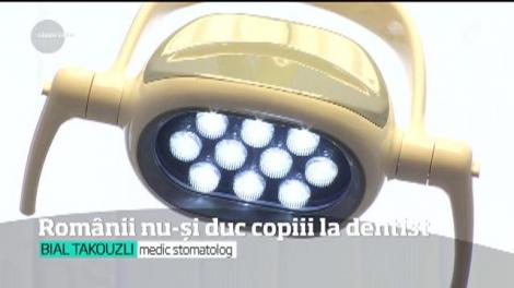 Românii îşi duc din ce în ce mai rar copiii la dentist