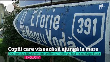 Trăiesc la 30 de kilometri de mare, dar n-au văzut-o niciodată. 10 frați din Constanța au o sigură dorință: să se joace în valurile sărate ale mării