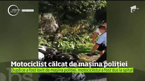 Imagini şocante în judeţul Braşov. Un motociclist strigă de durere, blocat sub maşina poliţiei!