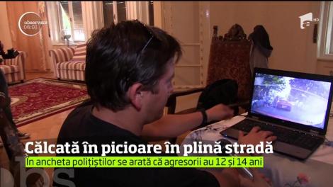 Călcată în picioare în faţa propriei case, de doi copii!