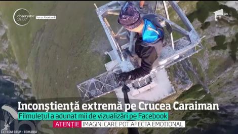 Inconștiență extremă pe Crucea Caraiman. Doi tineri teribilişti s-au filmat în timp ce, fără centuri şi cabluri de siguranţă, fac flotări pe monumen