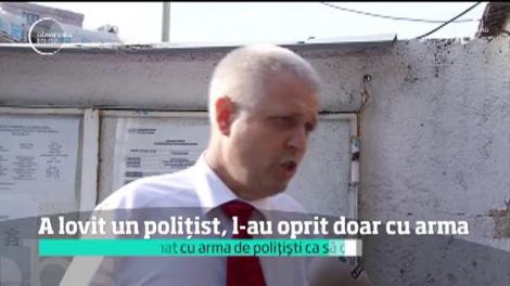 Un şofer a lovit cu maşina un poliţist în centrul Capitalei şi s-a oprit abia după ce a fost ameninţat cu arma.