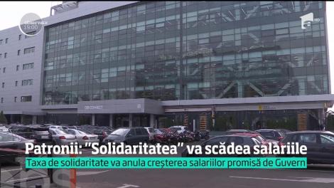 Patronii anunţă că vor scădea salariile de la anul. Controversata taxă de solidaritate va fi plătită de angajaţi