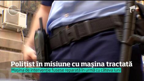 Imagini incredibile pe străzile din Bacău. Un polițist a pornit spre o spargere cu mașina tractată de un șofer binevoitor!