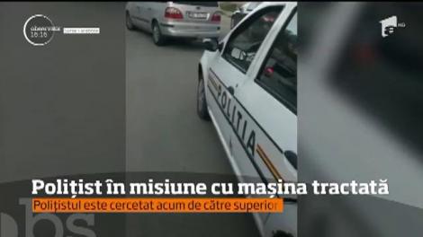 Polițistul care a plecat în misiune cu mașina tractată, cercetat de superiori