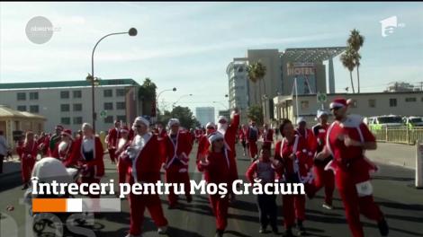 Întreceri pentru Moș Crăciun. Peste 160 de oameni îmbracați în Moș Crăciun au schiat în estul SUA