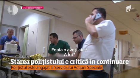 Polițistul atacat cu sabia este încă în stare critcă. Agentul a fost atacat în timpul unor percheziții la domiciliu