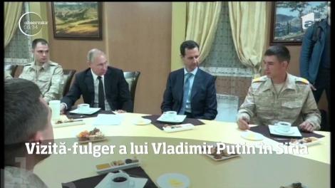Vladimir Putin a făcut o vizită neaşteptată în Siria, unde s-a întâlnit cu militarii ruşi şi cu preşedintele Başar al-Assad