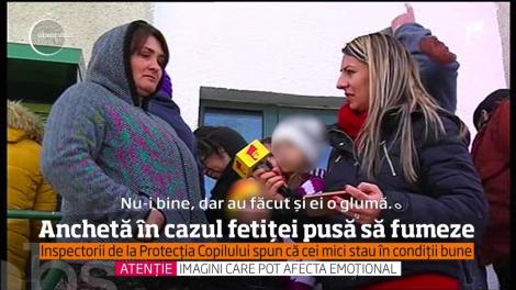 Anchetă în cazul fetiţei de doi ani din Tulcea, încurajată de părinţi să fumeze şi să bea cafea