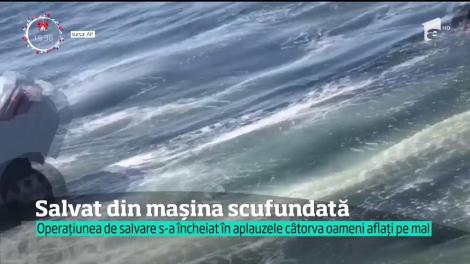 Operaţiune de salvare dramatică în Statele Unite. Un bărbat a fost scos în ultima clipă din maşina scufundată pe jumătate în ocean