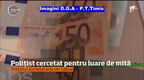 Polițist cercetat pentru luare de mită