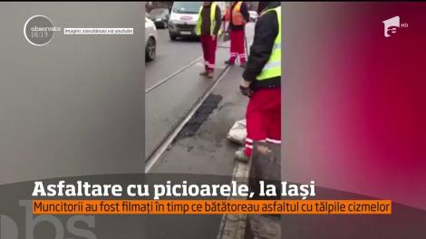 Dorele, mai poți? Asfaltare făcută cu picioarele, la Iaşi! Muncitorii, filmați în timp ce presau asfaltul cu cizmele: "Țopăiau pe el ca să-l netezească!"