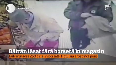 Filmat de camerele de supraveghere ale unui magazin în timp ce fura borseta unui bătrân