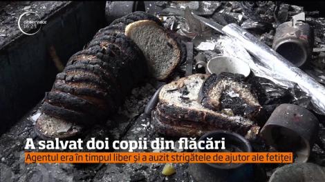 Un poliţist din Hunedoara a salvat doi copii din flăcări